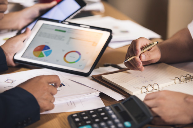 business people analysis graph report in the office room